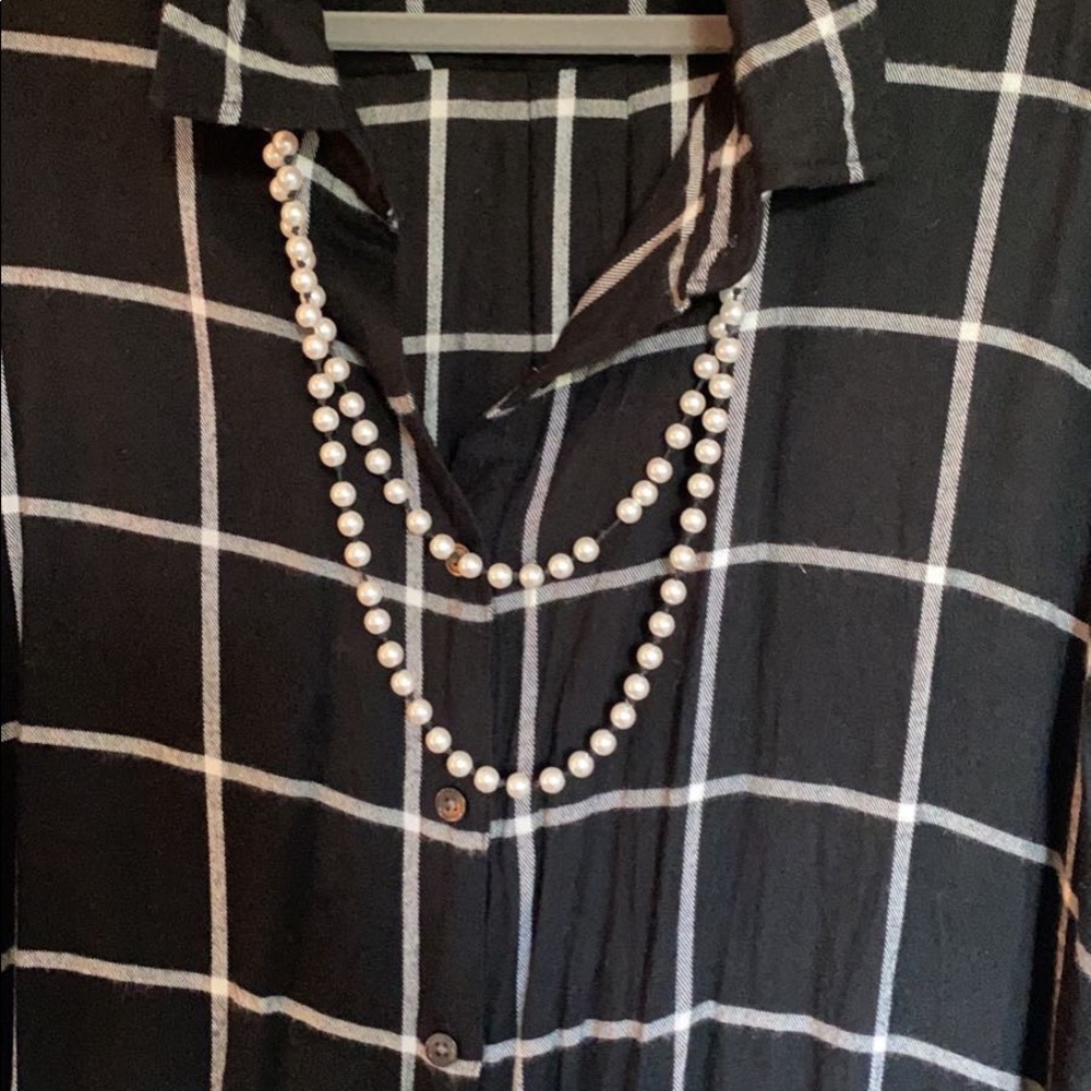 Faux pearl necklace on black rope